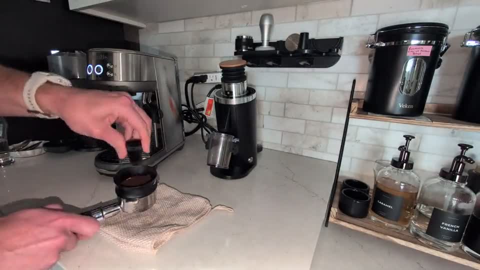 Original espresso instruction image showing the needle distribution tool in the portafilter